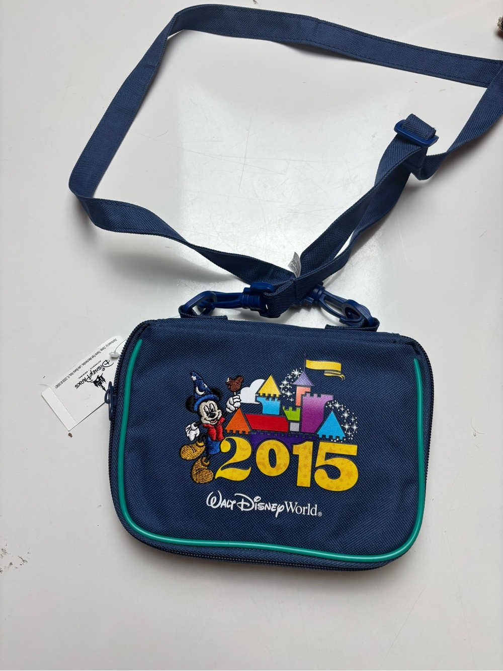 Walt Disney World 2015 blue crossbody pin holder bag with 2015 disney pins